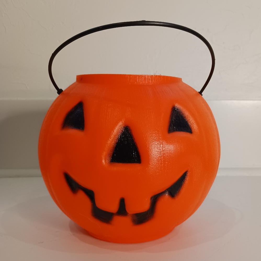 Small plastic jack-o-lantern bucket